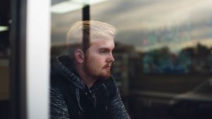 man sitting by a window